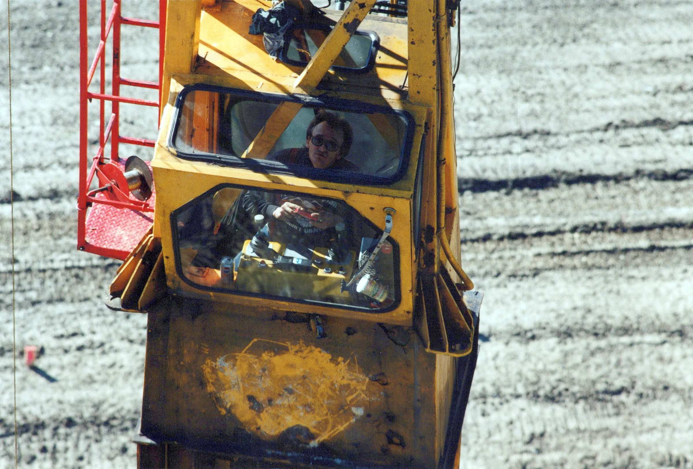 JDA equipment operator in crane cab at the pit